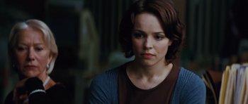Movie still from “State of Play” (2009), directed by Kevin Macdonald – A person with short brown hair; Close Up shot, Over the shoulder angle