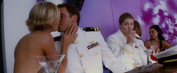 Movie still from “Stealth” (2005), directed by Rob Cohen – A man and a woman kissing in front of another man in a uniform; Medium shot, Over the shoulder angle