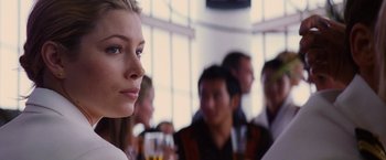 Movie still from “Stealth” (2005), directed by Rob Cohen – A group of people sitting in a room with drinks; Close Up shot, Over the shoulder angle