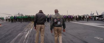 Movie still from “Stealth” (2005), directed by Rob Cohen – A group of men walking down a street; Medium shot, Over the shoulder angle