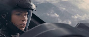 Movie still from “Stealth” (2005), directed by Rob Cohen – A person wearing a helmet is flying a plane; Close Up shot, High angle