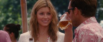 Movie still from “Stealth” (2005), directed by Rob Cohen – A beautiful young lady drinking a glass of beer; Close Up shot, Over the shoulder angle