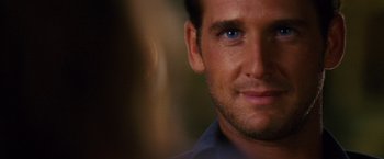 Movie still from “Stealth” (2005), directed by Rob Cohen – A man's face in a dark room; Close Up shot, Over the shoulder angle