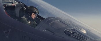 Movie still from “Stealth” (2005), directed by Rob Cohen – A man in a fighter pilot's helmet sitting in the cockpit of an aircraft; Medium shot, Low angle