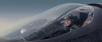 Movie still from “Stealth” (2005), directed by Rob Cohen – A man sitting in the cockpit of an airplane; Medium shot, Low angle