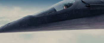 Movie still from “Stealth” (2005), directed by Rob Cohen – A fighter jet pilot sitting in the cockpit of an aircraft; Wide shot, Overhead angle