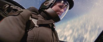 Movie still from “Stealth” (2005), directed by Rob Cohen – A person wearing a helmet is flying in the sky; Close Up shot, Overhead angle