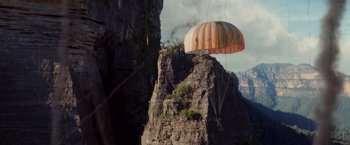 Movie still from “Stealth” (2005), directed by Rob Cohen – A parachute is attached to a rock formation; Extreme Wide shot, Low angle