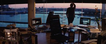 Movie still from “Stealth” (2005), directed by Rob Cohen – A man and a woman looking out a large window; Wide shot, Over the shoulder angle