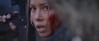 Movie still from “Stealth” (2005), directed by Rob Cohen – A woman with a blood - covered face; Close Up shot, Over the shoulder angle