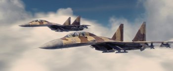 Movie still from “Stealth” (2005), directed by Rob Cohen – Two fighter jets flying through the air in the sky; Extreme Wide shot, Low angle