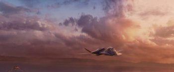 Movie still from “Stealth” (2005), directed by Rob Cohen – A fighter jet flying through the air at sunset; Extreme Wide shot, Low angle