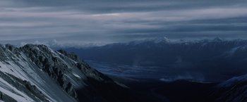 Movie still from “Stealth” (2005), directed by Rob Cohen – A view of a mountain range at night with fog; Extreme Wide shot, Low angle
