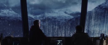 Movie still from “Stealth” (2005), directed by Rob Cohen – Two people looking at a screen in front of mountains; Extreme Wide shot, Over the shoulder angle