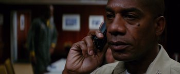 Movie still from “Stealth” (2005), directed by Rob Cohen – A person talking on a cell phone; Close Up shot, Low angle