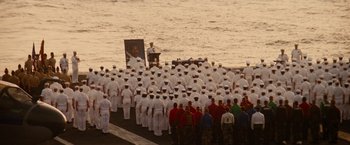 Movie still from “Stealth” (2005), directed by Rob Cohen – A large group of sailors standing on the deck of a ship; Extreme Wide shot, High angle