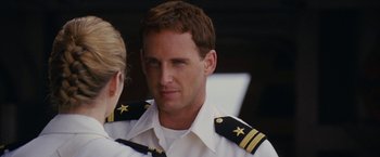 Movie still from “Stealth” (2005), directed by Rob Cohen – A person wearing a uniform; Close Up shot, Over the shoulder angle