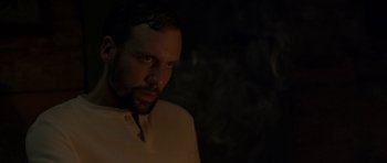 Movie still from “Still” (2018), directed by Takashi Doscher – A person wearing a white shirt; Close Up shot, Low angle