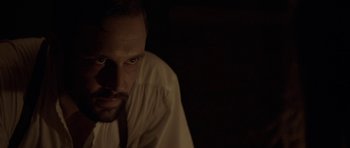 Movie still from “Still” (2018), directed by Takashi Doscher – A person wearing a white shirt; Close Up shot, Over the shoulder angle