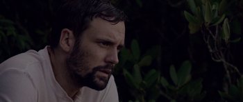 Movie still from “Still” (2018), directed by Takashi Doscher – A person wearing a white shirt; Close Up shot, Low angle