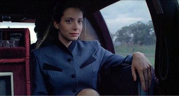 Movie still from “Stormy Monday” (1988), directed by Mike Figgis – A woman sitting in the back seat of a car; Close Up shot, Low angle