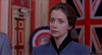 Movie still from “Stormy Monday” (1988), directed by Mike Figgis – A person wearing a jacket; Close Up shot, High angle