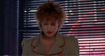 Movie still from “Stormy Monday” (1988), directed by Mike Figgis – A person wearing a jacket; Close Up shot, Low angle