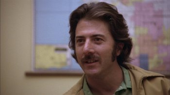 Movie still from “Straight Time” (1978), directed by Ulu Grosbard – A person with a mustache; Close Up shot, Low angle