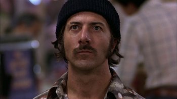 Movie still from “Straight Time” (1978), directed by Ulu Grosbard – A person wearing a hat; Close Up shot, Low angle