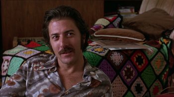 Movie still from “Straight Time” (1978), directed by Ulu Grosbard – A person sitting on a bed; Close Up shot, Low angle