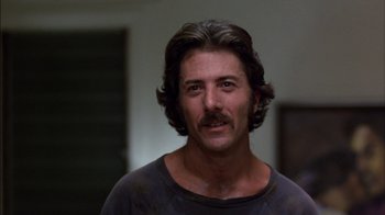 Movie still from “Straight Time” (1978), directed by Ulu Grosbard – A person with a mustache; Close Up shot, Low angle