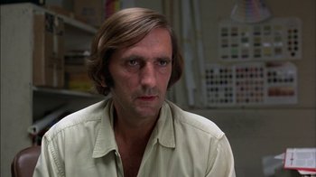 Movie still from “Straight Time” (1978), directed by Ulu Grosbard – A person with long hair; Close Up shot, Low angle