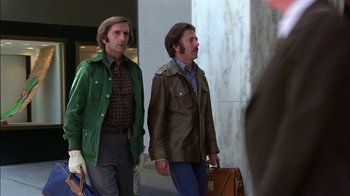 Movie still from “Straight Time” (1978), directed by Ulu Grosbard – A couple of men walking down a sidewalk; Medium shot, Low angle