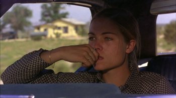 Movie still from “Straight Time” (1978), directed by Ulu Grosbard – A woman sitting in the back seat of a car looking out the window; Close Up shot, Over the shoulder angle