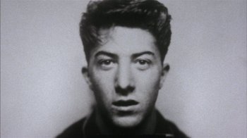 Movie still from “Straight Time” (1978), directed by Ulu Grosbard – An old black and white photo of a man's face; Close Up shot, Low angle