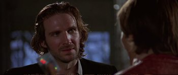 Movie still from “Strange Days” (1995), directed by Kathryn Bigelow – A person talking to another person; Close Up shot, Over the shoulder angle