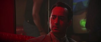 Movie still from “Strange Days” (1995), directed by Kathryn Bigelow – A person wearing a suit and tie; Close Up shot, Low angle