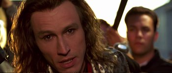 Movie still from “Strange Days” (1995), directed by Kathryn Bigelow – A person with long hair; Close Up shot, Low angle