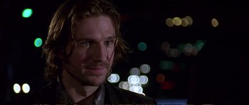 Movie still from “Strange Days” (1995), directed by Kathryn Bigelow – A person with long hair; Close Up shot, Low angle