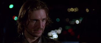 Movie still from “Strange Days” (1995), directed by Kathryn Bigelow – A person with long hair; Close Up shot, Low angle