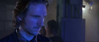 Movie still from “Strange Days” (1995), directed by Kathryn Bigelow – A person wearing a black shirt; Close Up shot, Over the shoulder angle