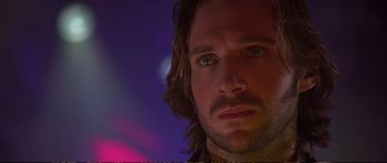 Movie still from “Strange Days” (1995), directed by Kathryn Bigelow – A person with long hair; Close Up shot, Over the shoulder angle