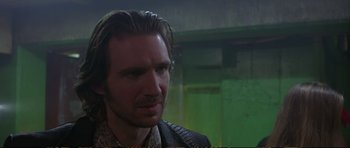 Movie still from “Strange Days” (1995), directed by Kathryn Bigelow – A person with long brown hair; Close Up shot, Over the shoulder angle