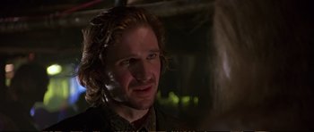 Movie still from “Strange Days” (1995), directed by Kathryn Bigelow – A person with long hair; Close Up shot, Over the shoulder angle