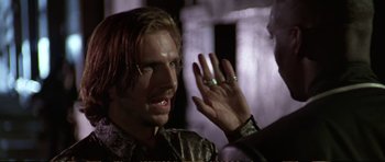 Movie still from “Strange Days” (1995), directed by Kathryn Bigelow – A person wearing a ring on their hand; Close Up shot, Over the shoulder angle