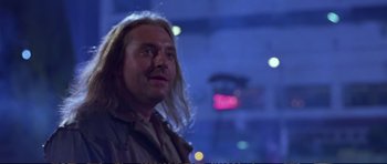 Movie still from “Strange Days” (1995), directed by Kathryn Bigelow – A person with long white hair; Close Up shot, Low angle