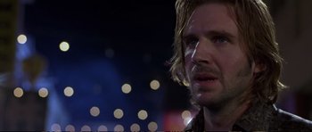 Movie still from “Strange Days” (1995), directed by Kathryn Bigelow – A person looking at the camera; Close Up shot, Over the shoulder angle