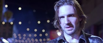 Movie still from “Strange Days” (1995), directed by Kathryn Bigelow – A person with long hair; Close Up shot, Over the shoulder angle