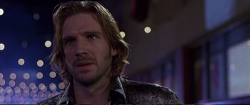 Movie still from “Strange Days” (1995), directed by Kathryn Bigelow – A person with long blonde hair; Close Up shot, Over the shoulder angle