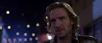 Movie still from “Strange Days” (1995), directed by Kathryn Bigelow – A person with long brown hair; Close Up shot, Over the shoulder angle